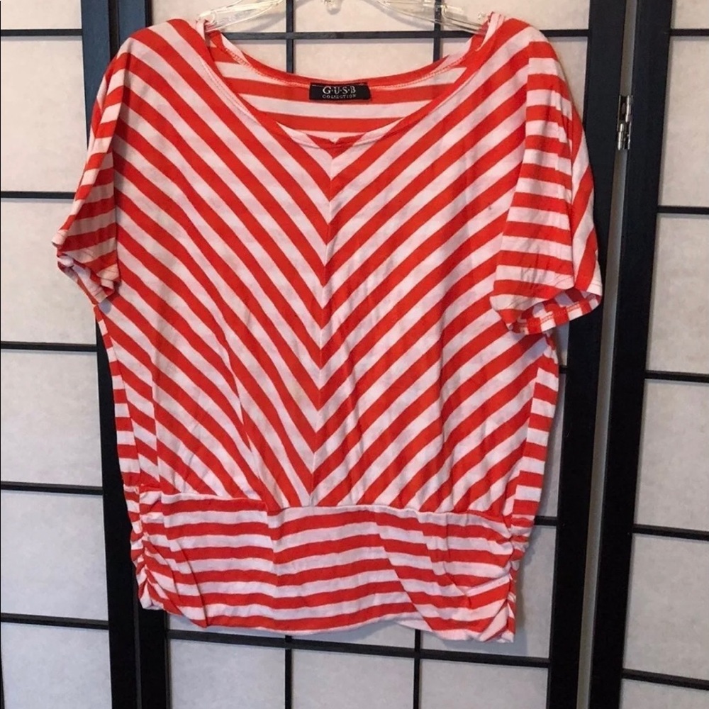 Guess brand sliming style diagonal lines summer top.
